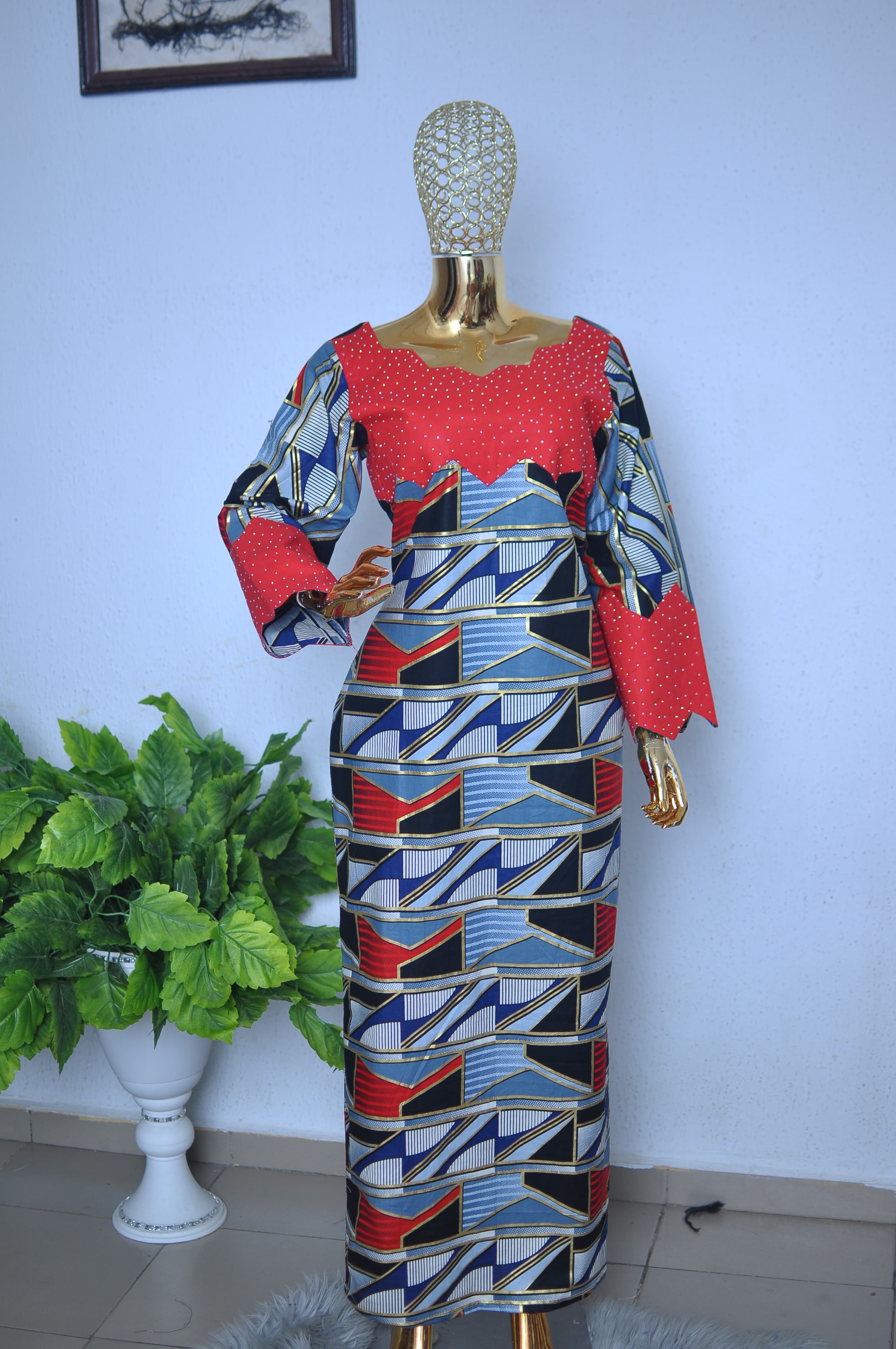 Ankara long dress with a crystal-studded red yoke and zigzag cuffs.