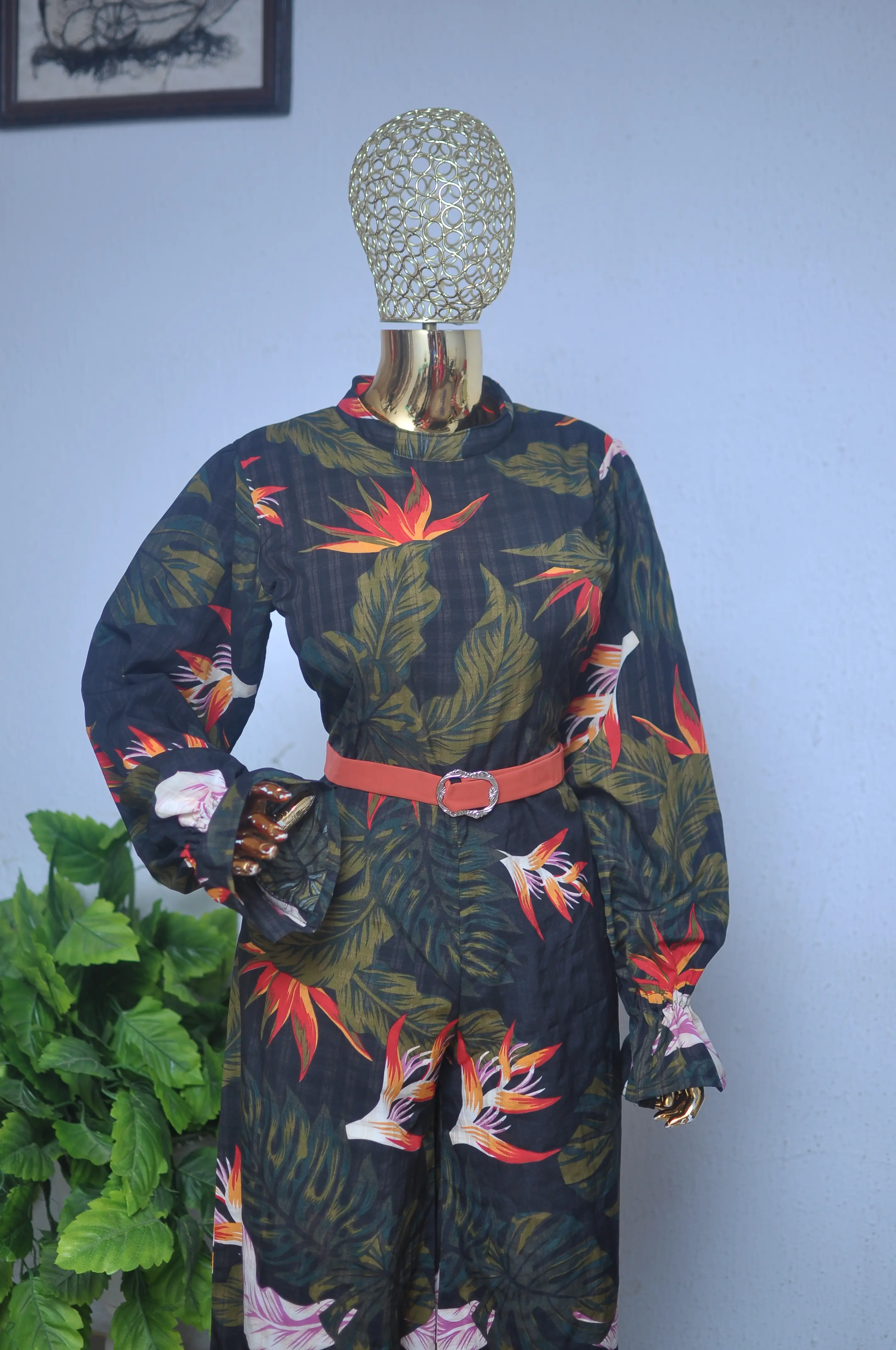 Bird-of-paradise print blouse and trousers co-ord, belted at the waist.