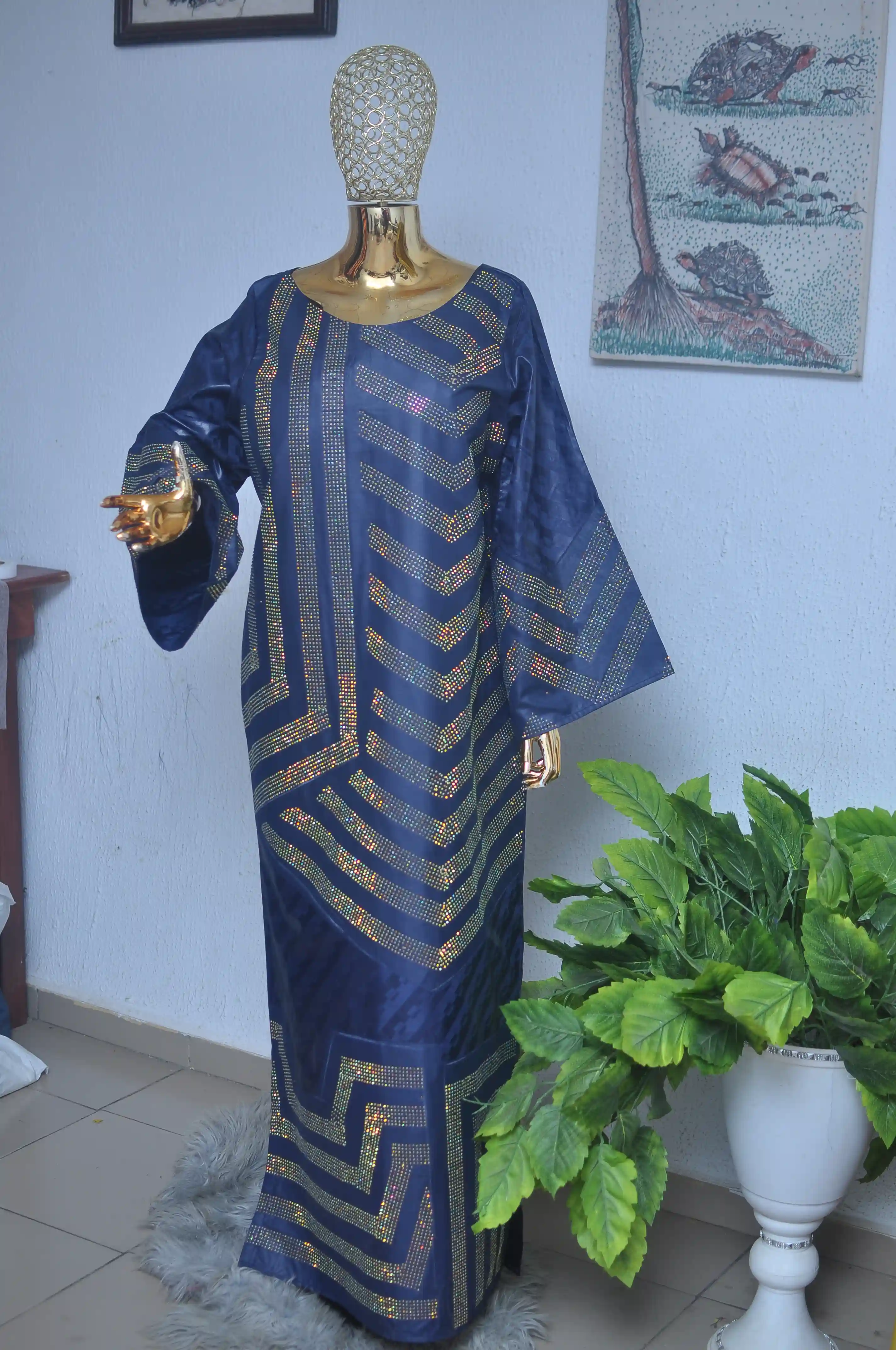 Navy boubou with metallic gold chevron embroidery and wide batwing sleeves.